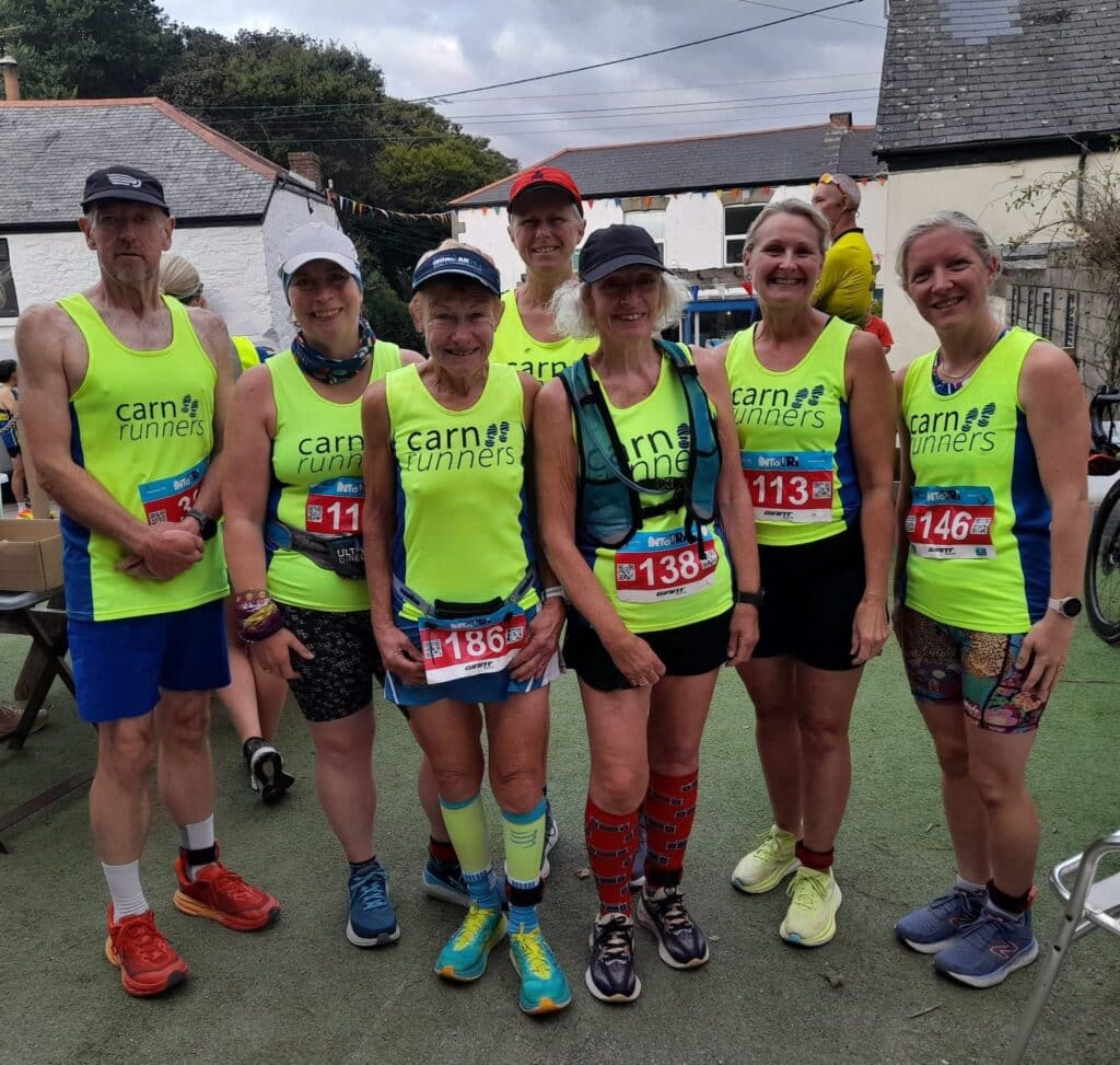 Carn Runners team at the inaugural St Agnes 5 Miler in Cornwall, scenic coastal backdrop