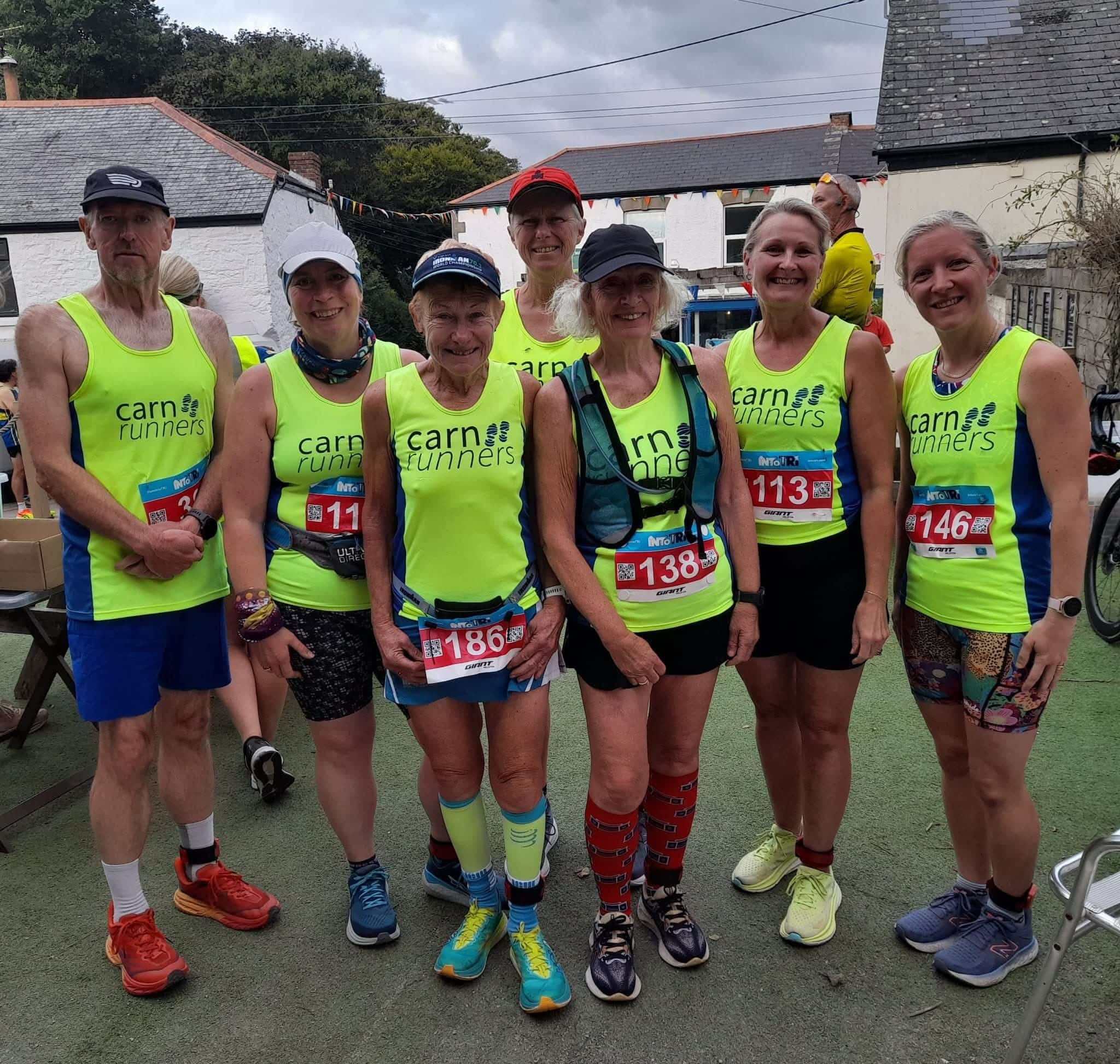 Carn Runners team at the inaugural St Agnes 5 Miler in Cornwall, scenic coastal backdrop