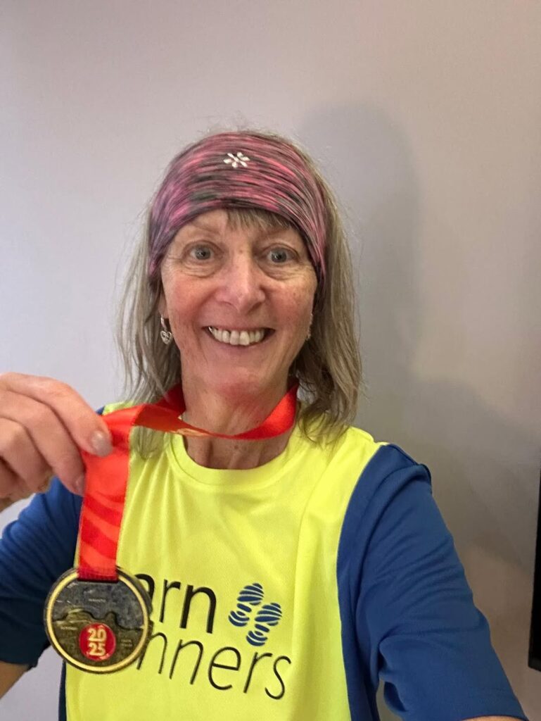 Shelagh representing Carn Runners at the Great North Run half marathon finish line