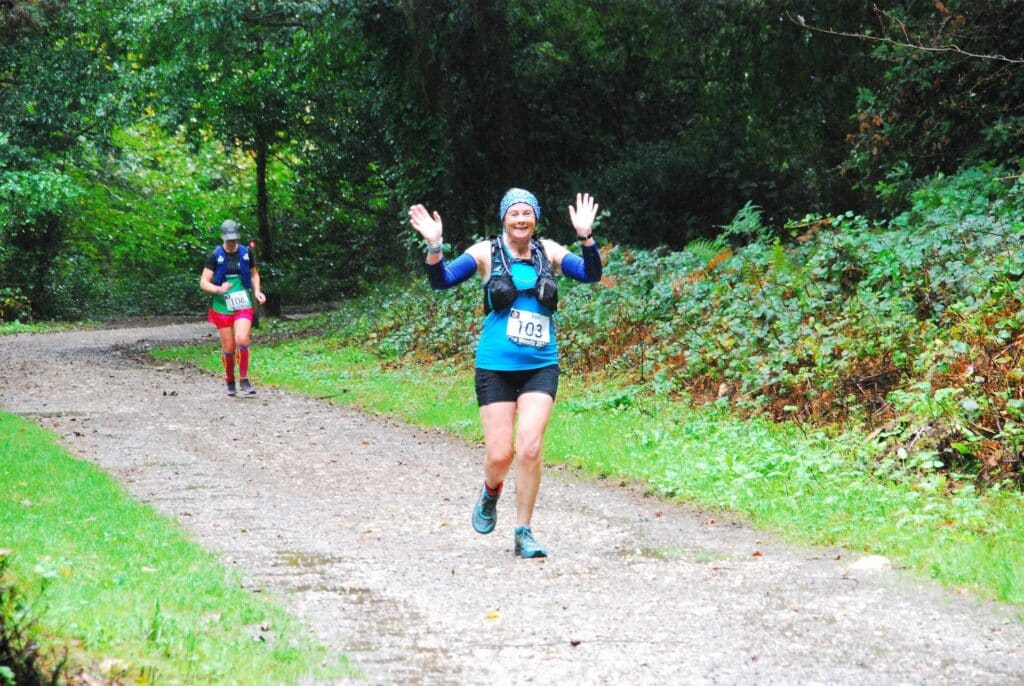 Carn Runners tackling The Woods endurance run in Tehidy Woods, Cornwall, in heavy rain