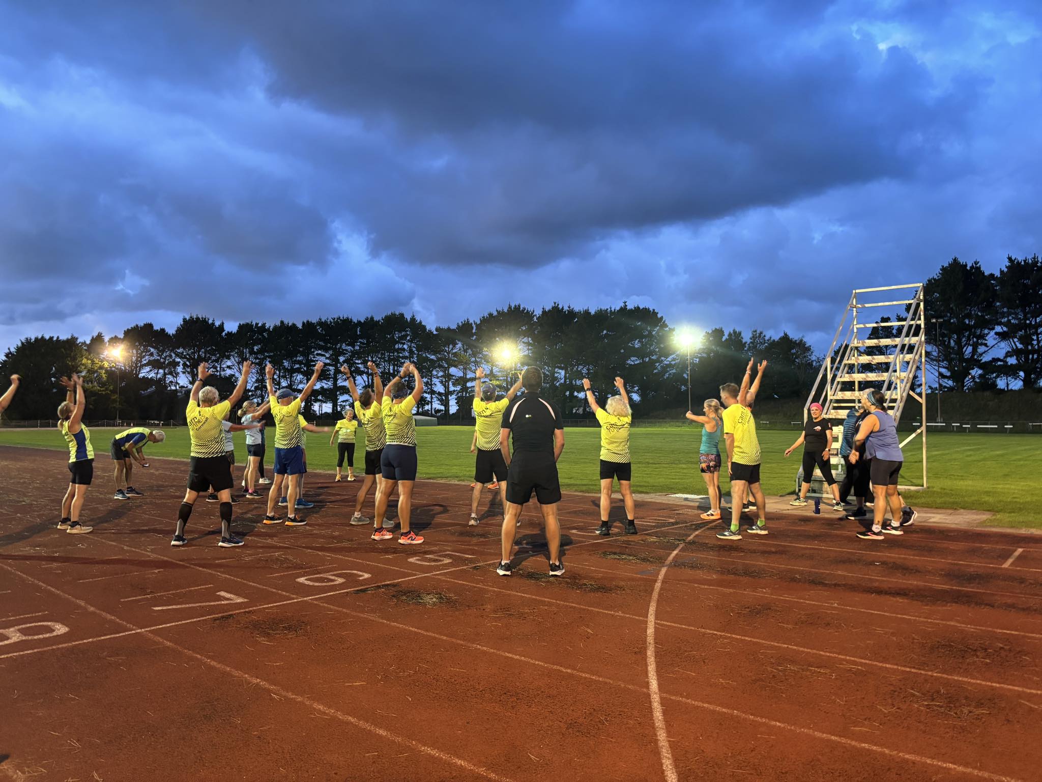 Carn Runners club members training on the running track with intervals and relays