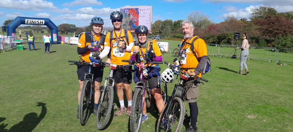 Linda and Lee with their medals after completing the Tour de Moor