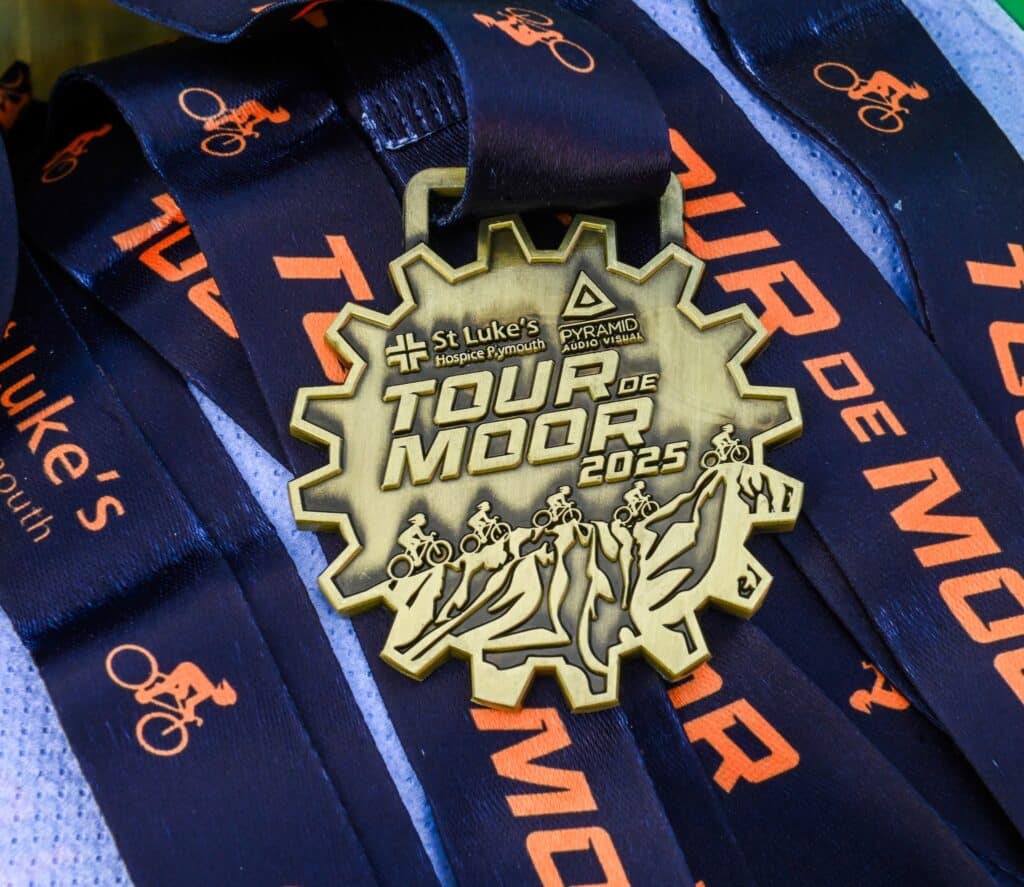 Linda and Lee with their medals after completing the Tour de Moor