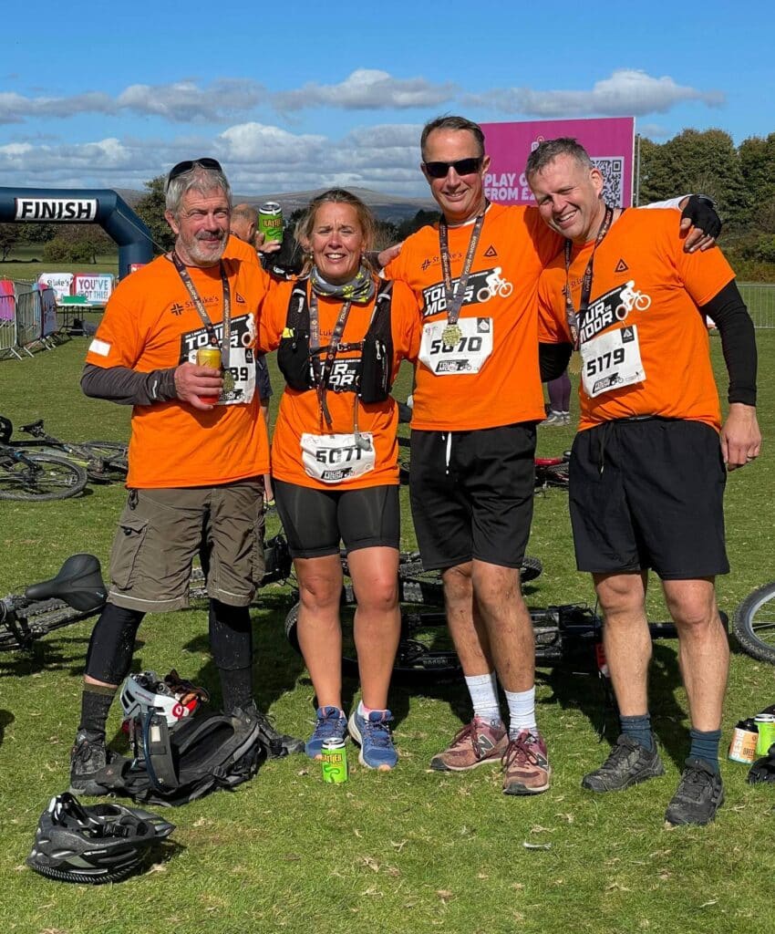 Linda and Lee with their medals after completing the Tour de Moor