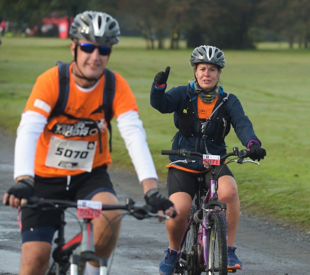 Linda and Lee with their medals after completing the Tour de Moor