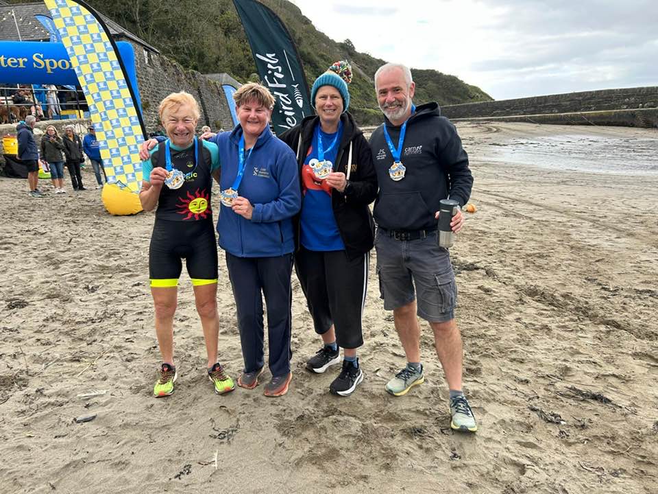 Carn Runners competing at the Polkerris Aquathon 2025