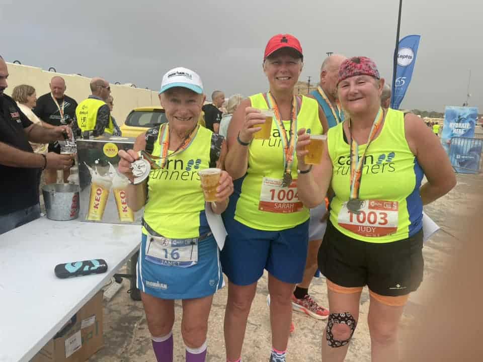 Carn Runners team enjoying the Leptos Cyprus 4 Day Challenge in Cyprus, celebrating after finishing multiple stages of the event.