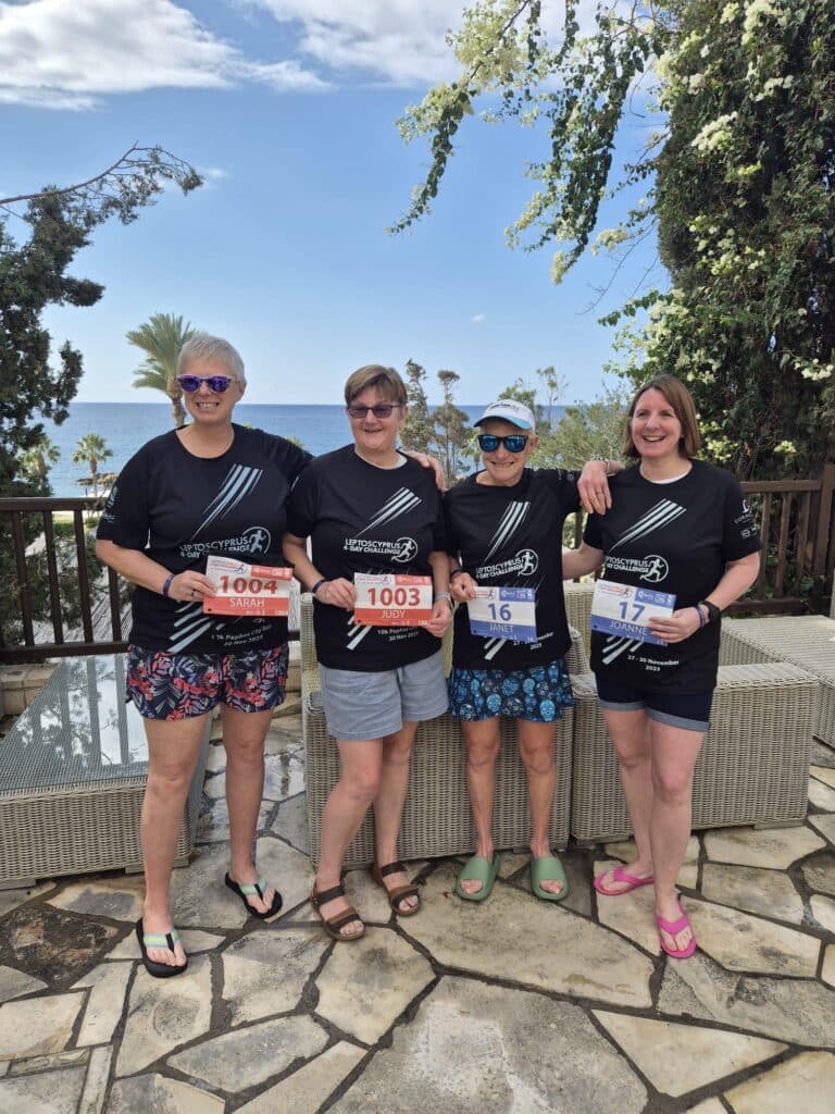 Carn Runners team enjoying the Leptos Cyprus 4 Day Challenge in Cyprus, celebrating after finishing multiple stages of the event.