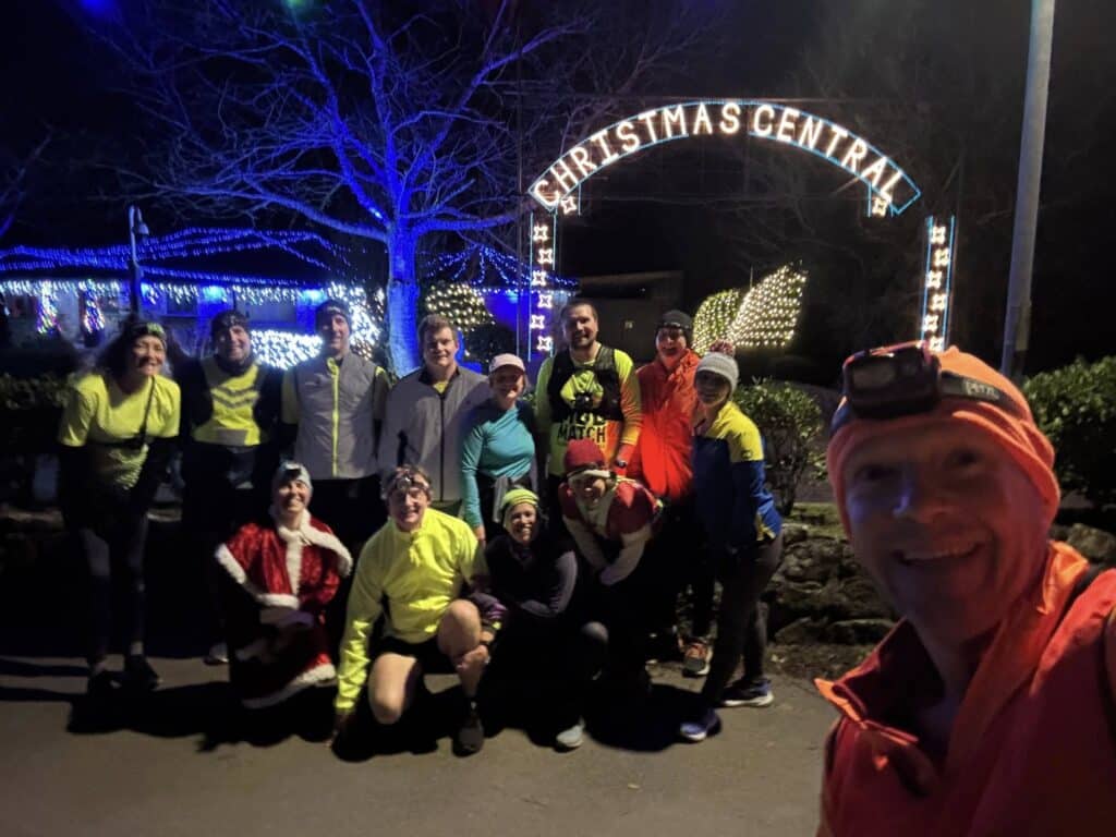 Carn Runners at the Angarrack Christmas lights during a festive club run