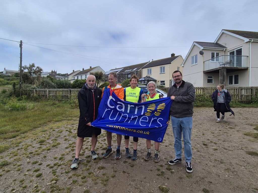 Carn Runners runners taking on the Classic Quarter coast path challenge from Lizard Point to Land's End