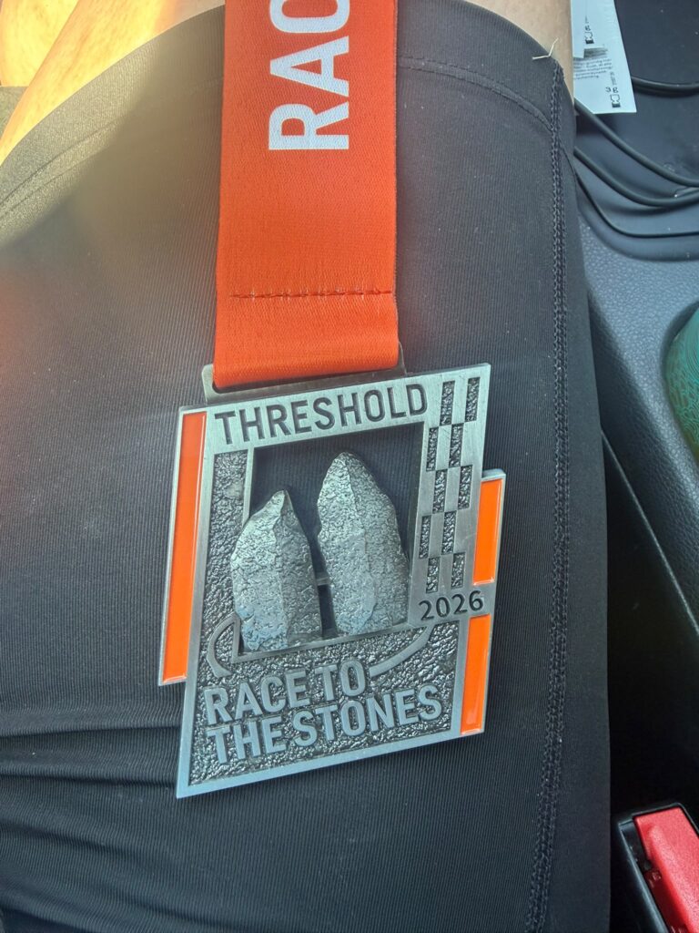 Tonia celebrating after completing her first ultra marathon at the Race to the Stones 50K