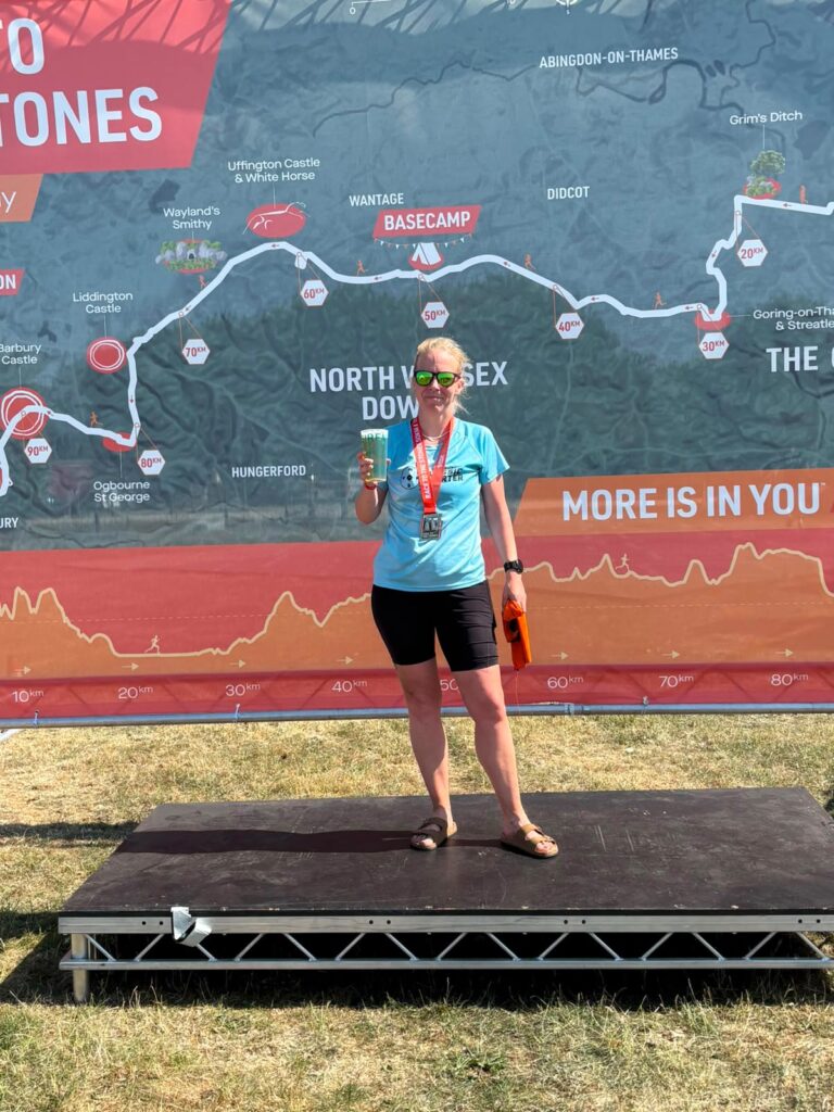 Tonia celebrating after completing her first ultra marathon at the Race to the Stones 50K