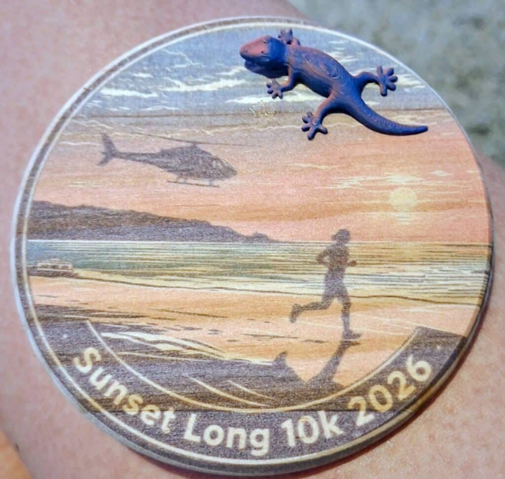 Claire running the Sunset Summer Long 10K along the coast from Crantock Bay to Perranporth