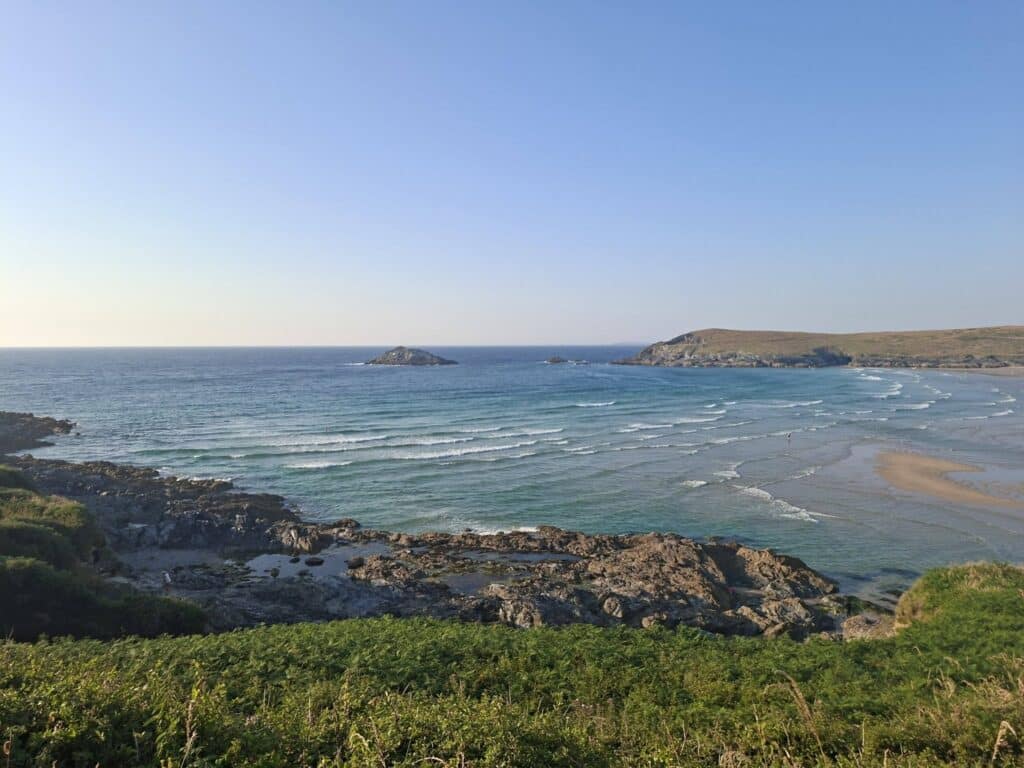 Claire running the Sunset Summer Long 10K along the coast from Crantock Bay to Perranporth
