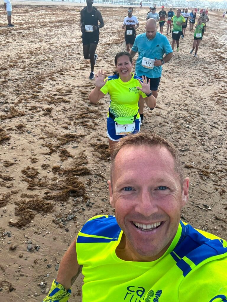 Carn Runners members taking part in an all-sand beach race and meeting at Pitchcroft parkrun in Worcester