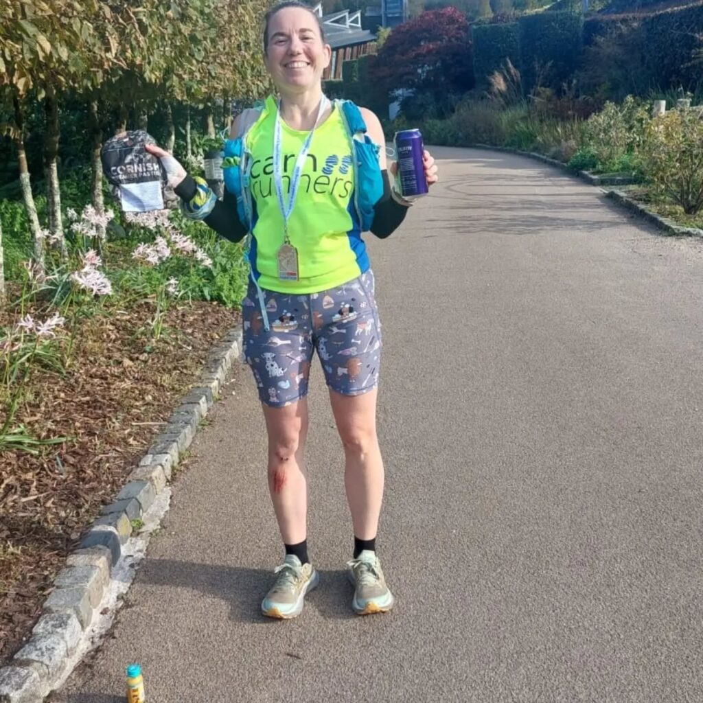 Runner on a hilly countryside trail, illustrating Bex’s Eden Project Marathon finish